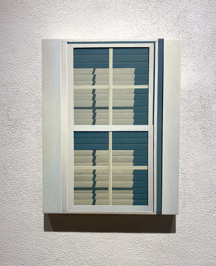 Image: Maddie Aunger, "Off-White Window (10:30am)," 2021, acrylic on panel. A painting on display of a pale, off-white window. The perspective is from the outside and the blinds are shut. Photo of artwork by the author.