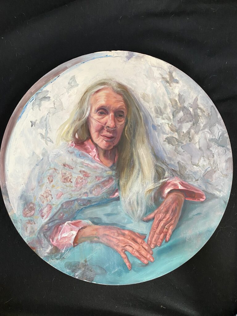 Image: Gaela Erwin, Ann Stewart Anderson, 2019-2021, oil on panel, 30" in diameter. A painting depicting an older woman in a bed with a light blue blanket on her. She has oxygen tubes in her nose and looks slightly towards the bottom right corner of the composition. Photograph by Gaela Erwin. 