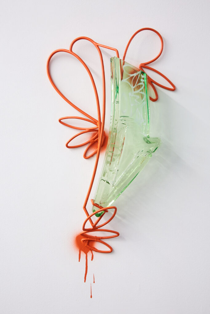 Image: Leo Tecosky, Green Flourish, 2019, glass, steel, paint, 36" x 18". A light green glass sculpture hangs on a white wall. A red-orange line loops around the sculpture and appears to drip towards the bottom. Courtesy of the artist and KMAC Museum. Photo by Ted Wathen.