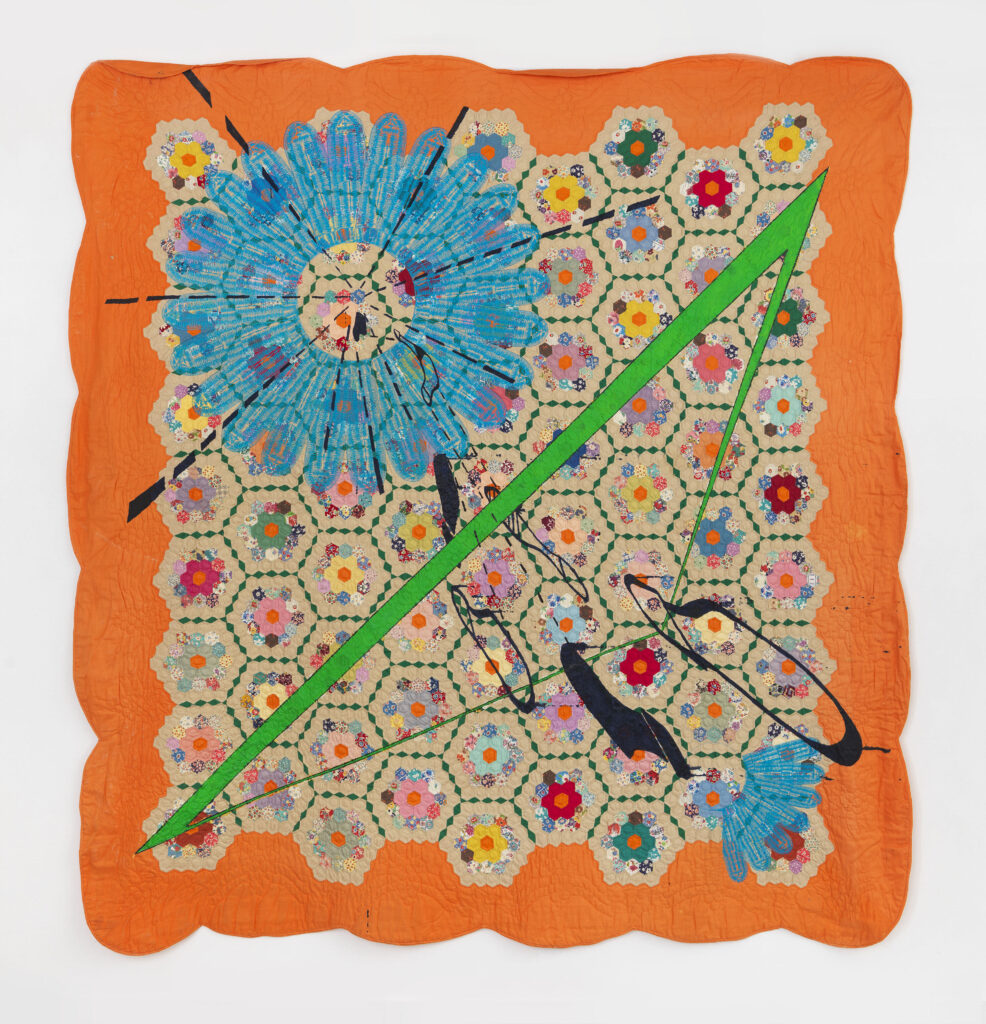 Image: Sanford Biggers, Flying Lotus, 2012. Embroidery, fabric treated acrylic, spray paint, cotton, ssbquilt037. Courtesy of the artist and Marianne Boesky Gallery, New York and Aspen. © Sanford Biggers. Photograph by Object Studies. A photograph of a colorful textile piece with traditional quilt patterns in the middle. The piece is outlined with orange and has a green stripe going diagonally across the center.