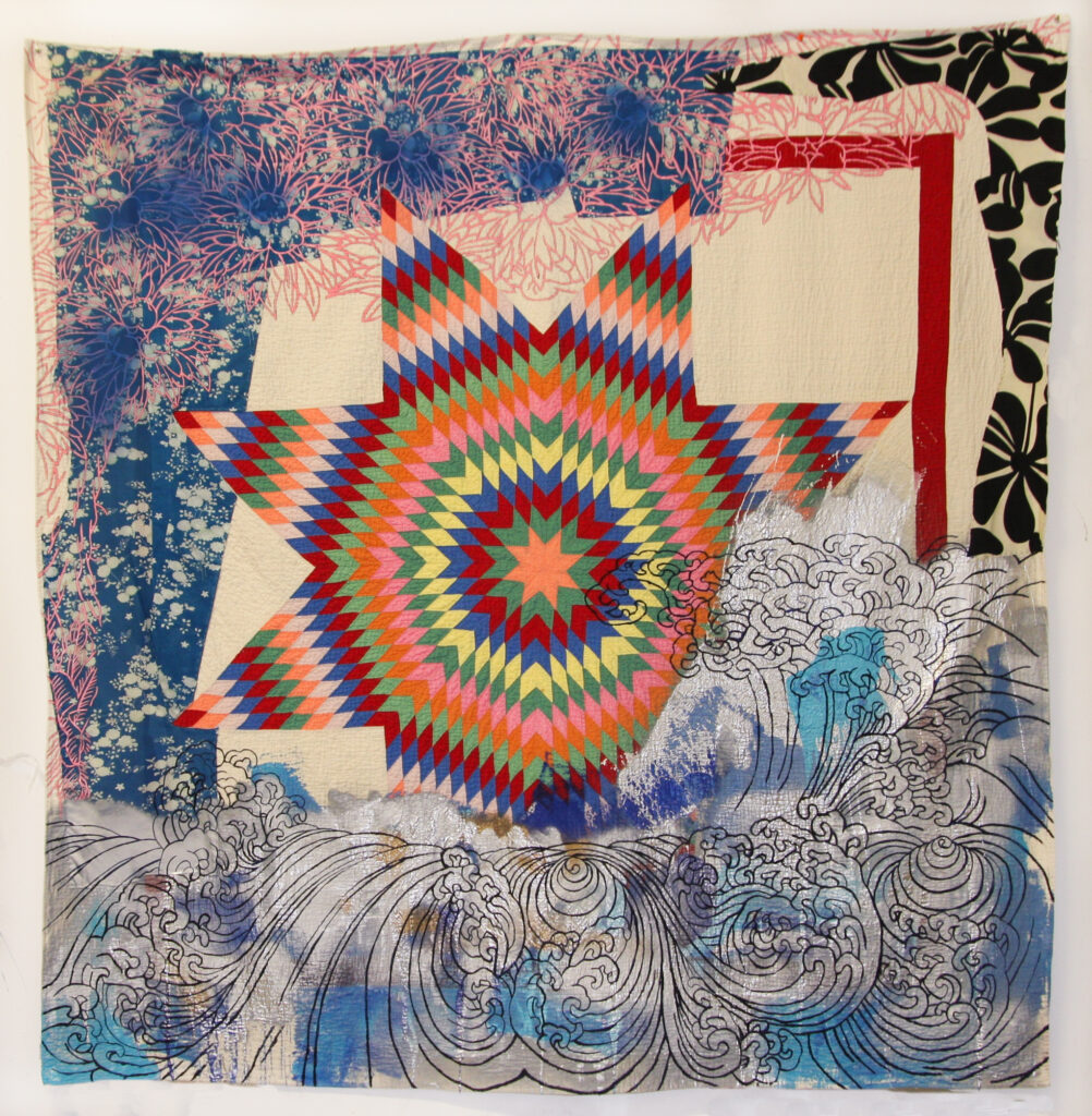 Image: Sanford Biggers, Everyday a Sunset Dies (LKG), 2014. Antique quilts, assorted textiles, spray paint. 78 x 78 in., ssbquilt048. © Sanford Biggers and Eric Firestone. A photo of a mixed media quilt piece with a colorful star pattern in the middle of the composition, and blue waves towards the bottom. Various other patterns weave in and out of the background.