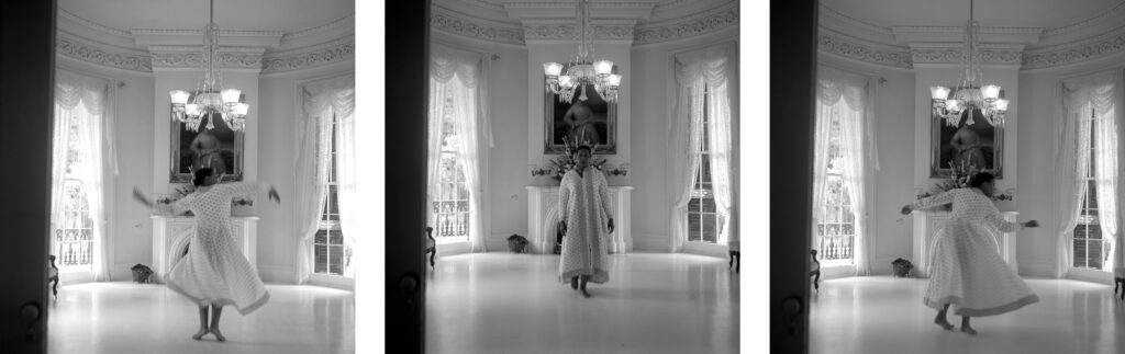 Image: Carrie Mae Weems, A Single’s Waltz in Time, 2003. Silver gelatin prints. Three black and white photos of a woman in a white dress moving around a room. Courtesy of 21c Museum Hotel, Nashville.